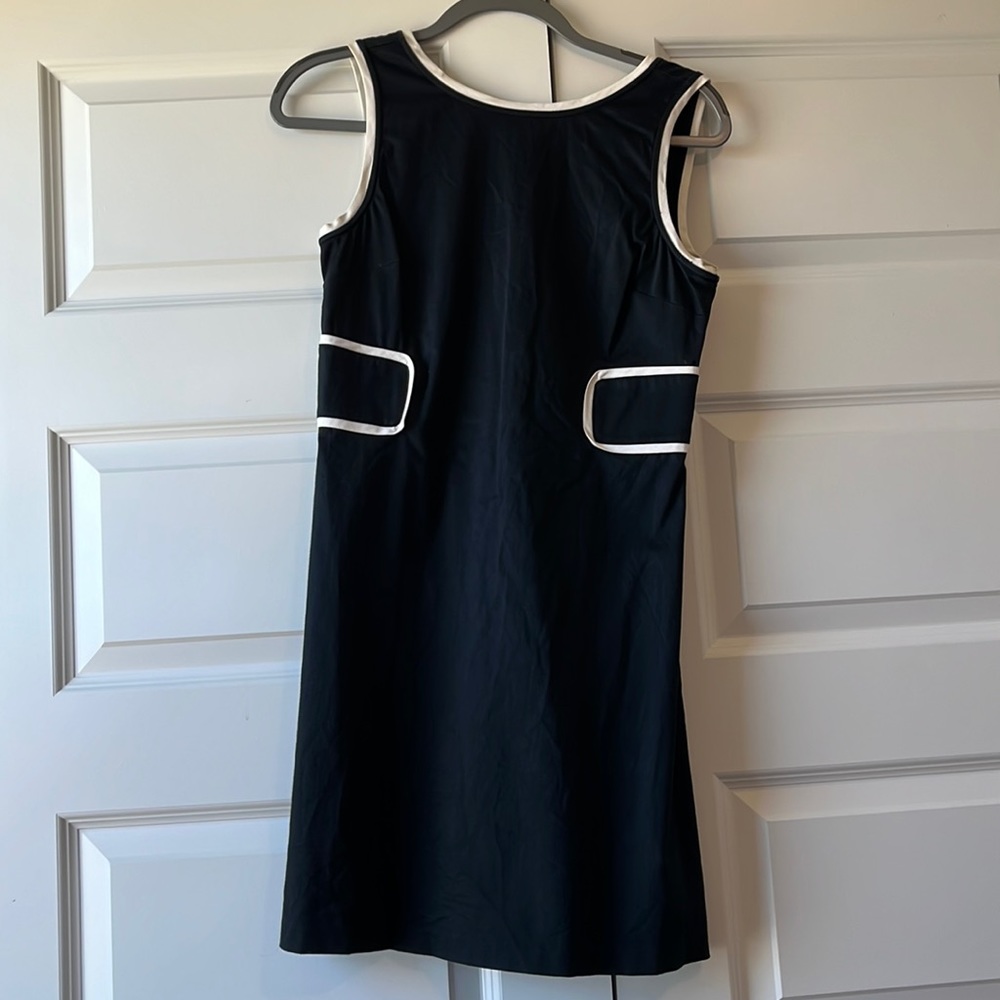 Lightweight, sleeveless little black dress with white trimming. Work to evening.
